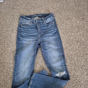 American Eagle Outfitters Medium Blue Skinny Jeans with Knee Rip